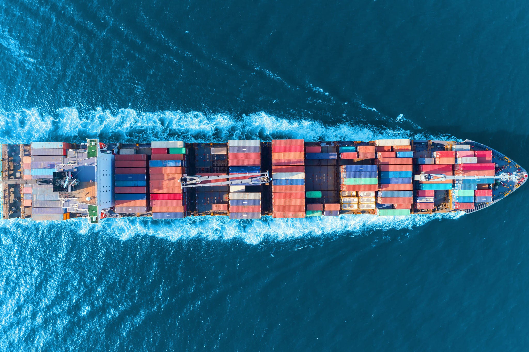 Aerial top view of a container ship in the sea